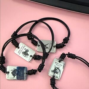 Black Cord Bracelet with Silver Plate Tag - We have all Zodiac Graphic signs